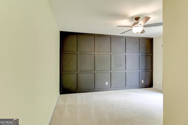 7520 Ledgewood Way, Suwanee, GA 30024 - unfurnished bedroom featuring a decorative wall, carpet floors, and ceiling fan