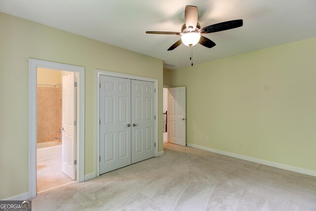 7520 Ledgewood Way, Suwanee, GA 30024 - unfurnished bedroom featuring carpet floors, connected bathroom, a closet, and a ceiling fan
