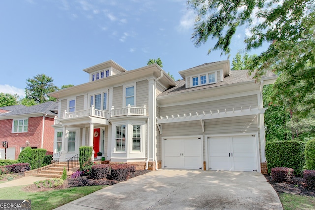 7520 Ledgewood Way, Suwanee, GA 30024 - view of front facade featuring a balcony and driveway