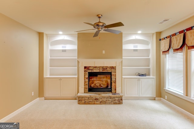 7520 Ledgewood Way, Suwanee, GA 30024 - unfurnished living room featuring ceiling fan, built in shelves, carpet, a stone fireplace, and recessed lighting