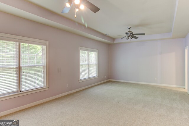 7520 Ledgewood Way, Suwanee, GA 30024 - carpeted empty room featuring a ceiling fan and a tray ceiling