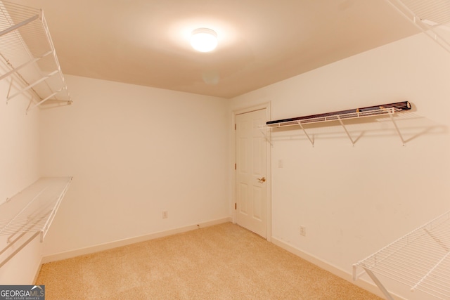 7520 Ledgewood Way, Suwanee, GA 30024 - walk in closet with light colored carpet