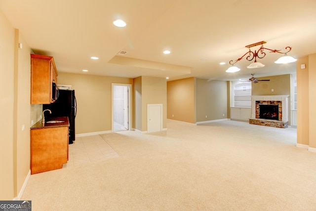 7520 Ledgewood Way, Suwanee, GA 30024 - unfurnished living room featuring light colored carpet, a ceiling fan, recessed lighting, and a brick fireplace