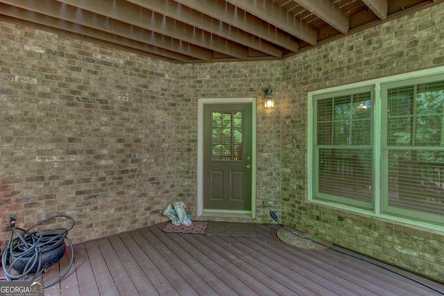 7520 Ledgewood Way, Suwanee, GA 30024 - doorway to property with brick siding and a wooden deck