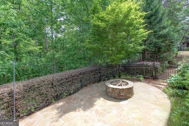 7520 Ledgewood Way, Suwanee, GA 30024 - view of patio / terrace featuring a fire pit