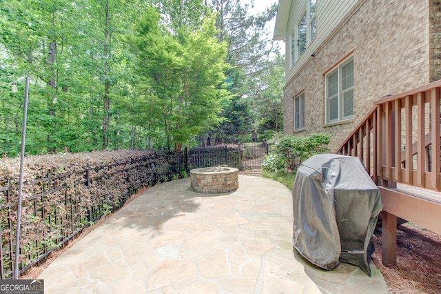 7520 Ledgewood Way, Suwanee, GA 30024 - view of patio with an outdoor fire pit and grilling area