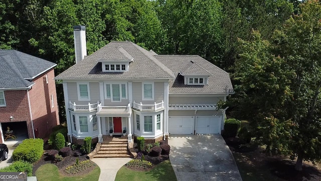 7520 Ledgewood Way, Suwanee, GA 30024 - view of front of property featuring driveway, a chimney, an attached garage, and roof with shingles