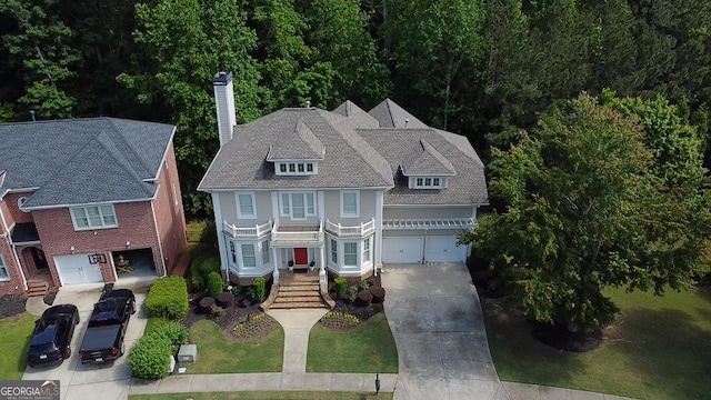 7520 Ledgewood Way, Suwanee, GA 30024 - view of front of home with a chimney, driveway, a garage, and stairway