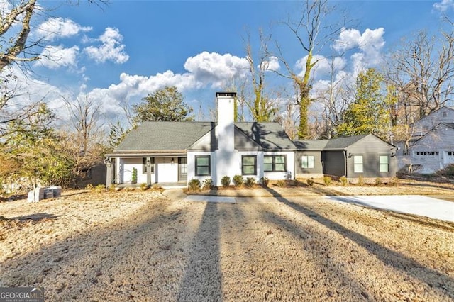 1571 Blvd Lorraine, Atlanta, GA 30311 - view of front facade featuring a chimney, covered porch, and dirt driveway