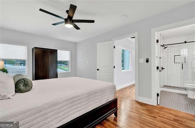 1571 Blvd Lorraine, Atlanta, GA 30311 - bedroom featuring wood finished floors, baseboards, ensuite bath, and ceiling fan