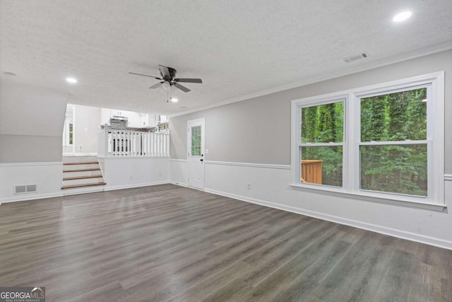 unfurnished living room with a ceiling fan, dark wood finished floors, recessed lighting, a textured ceiling, and ornamental molding