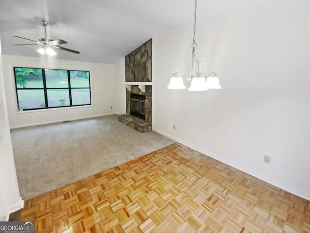 2325 Sebring Ct SW, Marietta, GA 30064 - unfurnished living room featuring ceiling fan, a stone fireplace, a chandelier, baseboards, and lofted ceiling