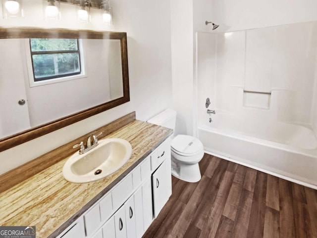 2325 Sebring Ct SW, Marietta, GA 30064 - bathroom featuring toilet, vanity, wood finished floors, and washtub / shower combination