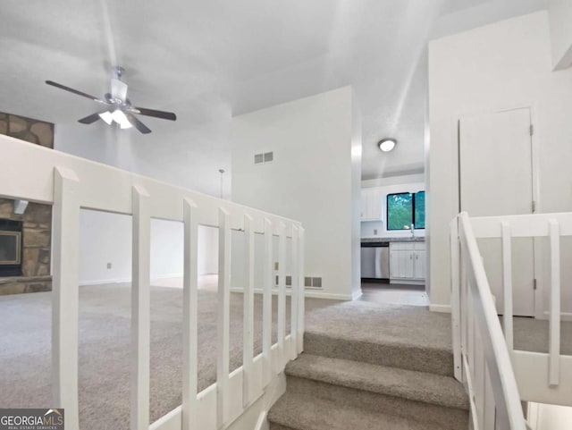 2325 Sebring Ct SW, Marietta, GA 30064 - stairway with carpet, a ceiling fan, and baseboards