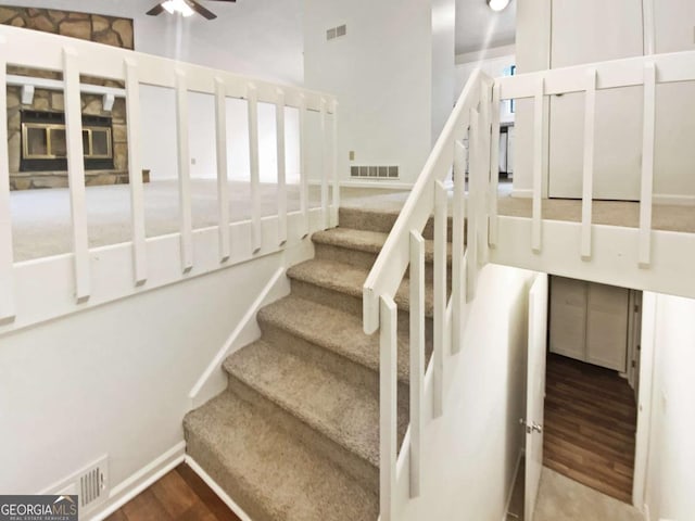 2325 Sebring Ct SW, Marietta, GA 30064 - stairway featuring wood finished floors, ceiling fan, and baseboards