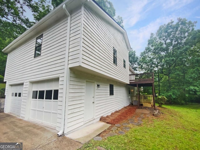 2325 Sebring Ct SW, Marietta, GA 30064 - view of property exterior with a garage, a lawn, a wooden deck, and concrete driveway