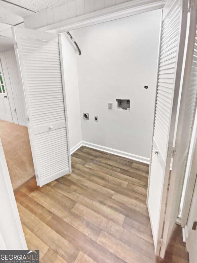 2325 Sebring Ct SW, Marietta, GA 30064 - laundry area featuring electric dryer hookup, washer hookup, wood finished floors, and baseboards