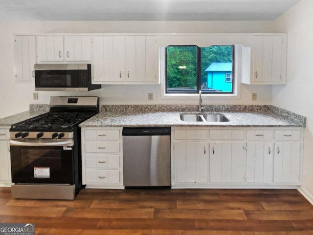 2325 Sebring Ct SW, Marietta, GA 30064 - kitchen featuring stainless steel appliances, a sink, white cabinets, and dark wood-type flooring
