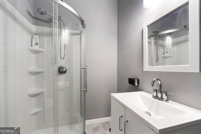 1892 Ivy View Walk, Loganville, GA 30052 - bathroom with a stall shower, marble look tile flooring, vanity, and baseboards