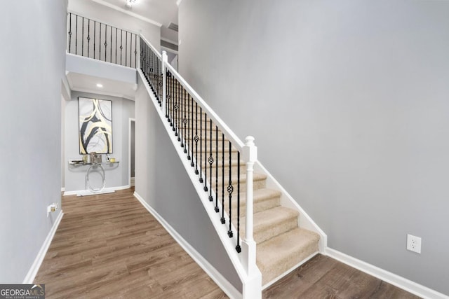 1892 Ivy View Walk, Loganville, GA 30052 - stairway featuring wood finished floors, baseboards, and ornamental molding