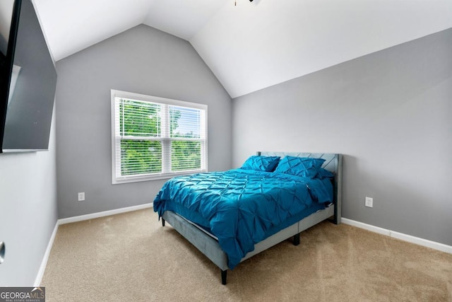 1892 Ivy View Walk, Loganville, GA 30052 - bedroom featuring carpet floors, vaulted ceiling, and baseboards