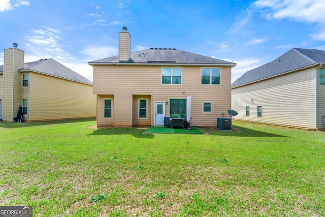 1892 Ivy View Walk, Loganville, GA 30052 - back of property featuring a yard, central AC, and a chimney