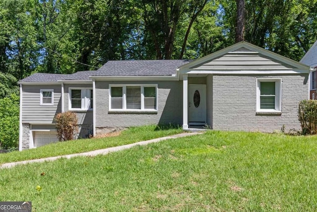 2025 Venetian Dr SW, Atlanta, GA 30311 - single story home featuring a garage, a front yard, and brick siding
