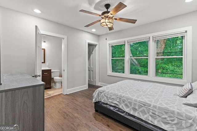 2025 Venetian Dr SW, Atlanta, GA 30311 - bedroom with dark wood-style flooring, baseboards, recessed lighting, multiple windows, and connected bathroom