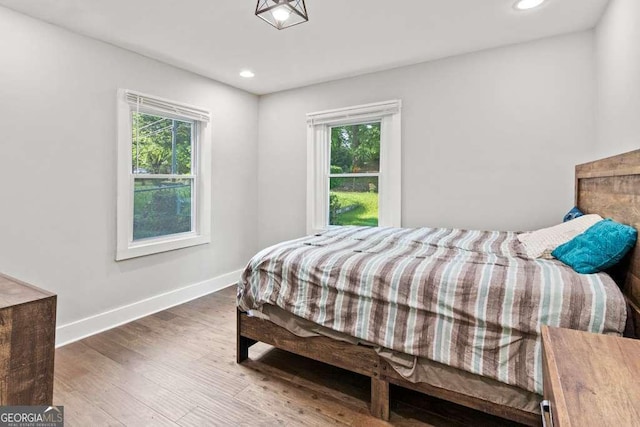 2025 Venetian Dr SW, Atlanta, GA 30311 - bedroom with multiple windows, baseboards, wood finished floors, and recessed lighting