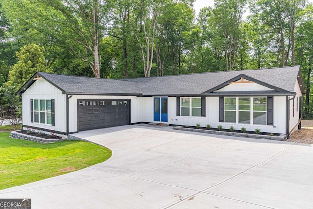 2265 Hillbriar Dr, Buford, GA 30518 - view of front of house featuring driveway, an attached garage, and a shingled roof