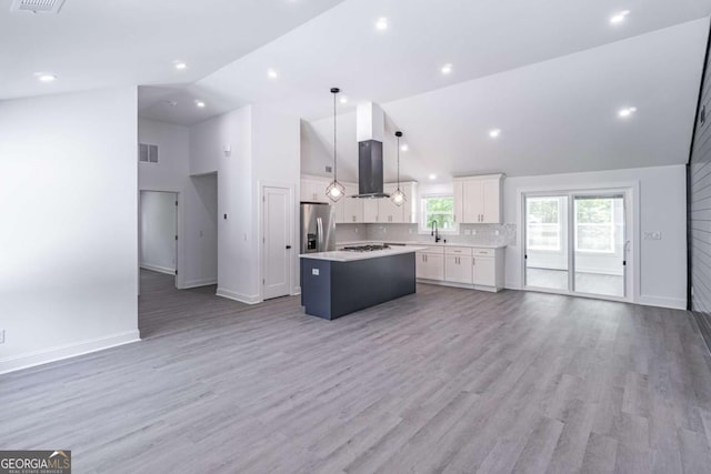 2265 Hillbriar Dr, Buford, GA 30518 - kitchen with open floor plan, a center island, stainless steel fridge with ice dispenser, a sink, and white cabinetry