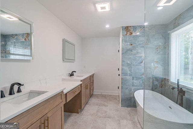 2265 Hillbriar Dr, Buford, GA 30518 - full bathroom with walk in shower, a freestanding bath, vanity, baseboards, and recessed lighting