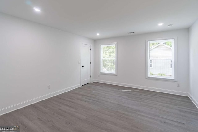 2265 Hillbriar Dr, Buford, GA 30518 - empty room featuring dark wood-style floors, healthy amount of natural light, baseboards, and recessed lighting