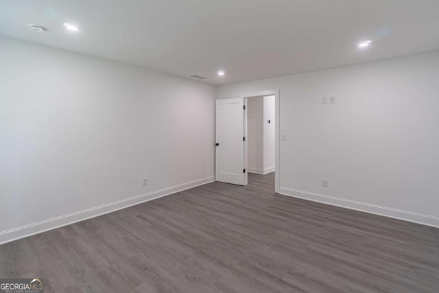 2265 Hillbriar Dr, Buford, GA 30518 - spare room featuring dark wood-style floors, recessed lighting, and baseboards