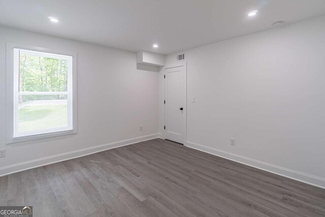 2265 Hillbriar Dr, Buford, GA 30518 - empty room featuring dark wood-style floors, baseboards, and recessed lighting