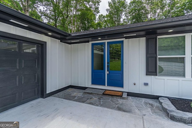 2265 Hillbriar Dr, Buford, GA 30518 - property entrance with board and batten siding and roof with shingles