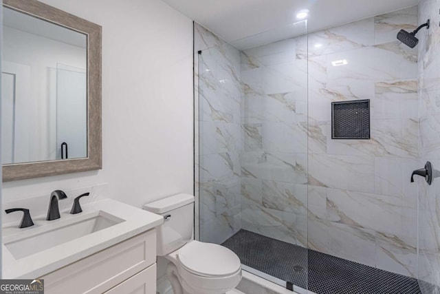 2265 Hillbriar Dr, Buford, GA 30518 - bathroom featuring toilet, a marble finish shower, and vanity