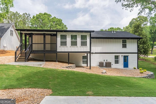 2265 Hillbriar Dr, Buford, GA 30518 - rear view of property featuring cooling unit, a yard, brick siding, and roof with shingles