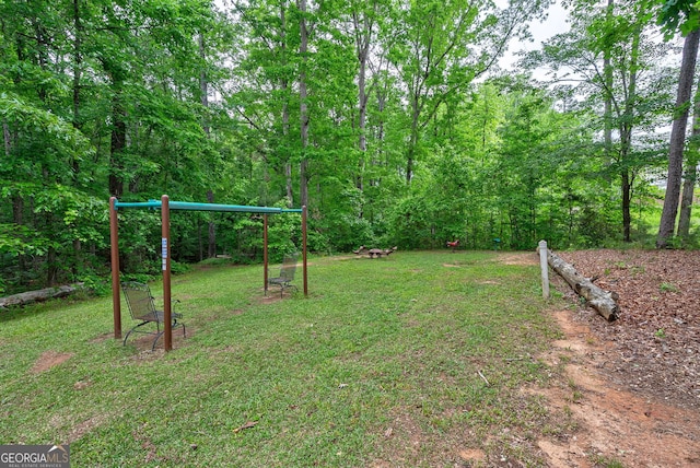 view of grassy yard with a playground