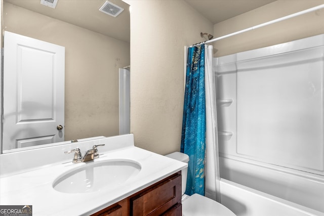 full bath with toilet, vanity, and shower / tub combo with curtain