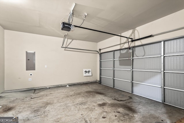garage with electric panel and a garage door opener
