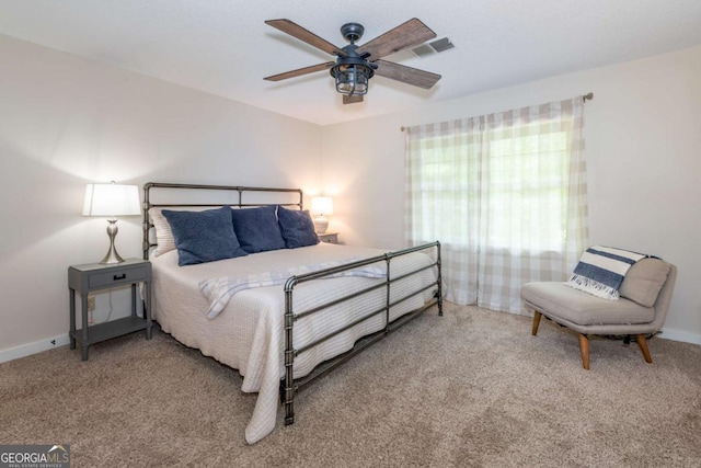 bedroom with carpet, baseboards, and a ceiling fan
