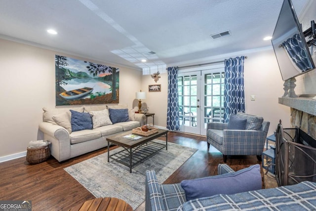 living area featuring french doors, baseboards, crown molding, wood finished floors, and recessed lighting