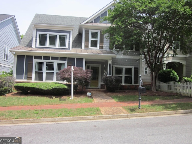 1527 Princeton Ave, College Park, GA 30337 - view of front facade featuring a standing seam roof, metal roof, roof with shingles, and fence