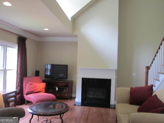 1527 Princeton Ave, College Park, GA 30337 - living room featuring stairway, wood finished floors, recessed lighting, and a glass covered fireplace
