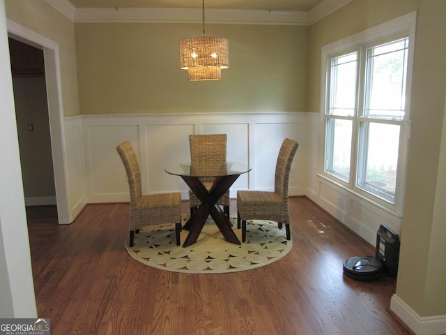 1527 Princeton Ave, College Park, GA 30337 - dining area featuring a decorative wall, a chandelier, crown molding, plenty of natural light, and wood finished floors