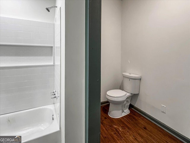 bathroom with toilet and wood finished floors
