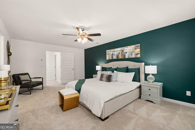 carpeted bedroom with baseboards and ceiling fan