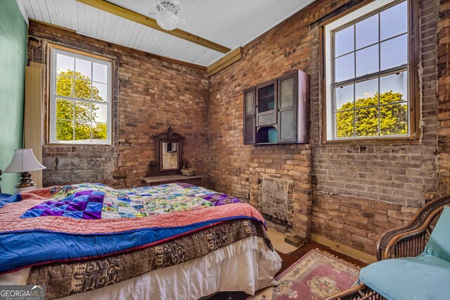 1 Public Sq, Bowman, GA 30624 - bedroom with brick wall and a wood stove