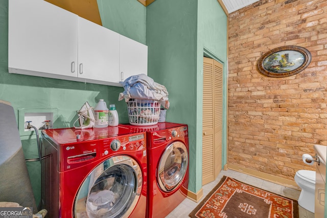 1 Public Sq, Bowman, GA 30624 - laundry area featuring washer and dryer, tile patterned flooring, baseboards, and brick wall